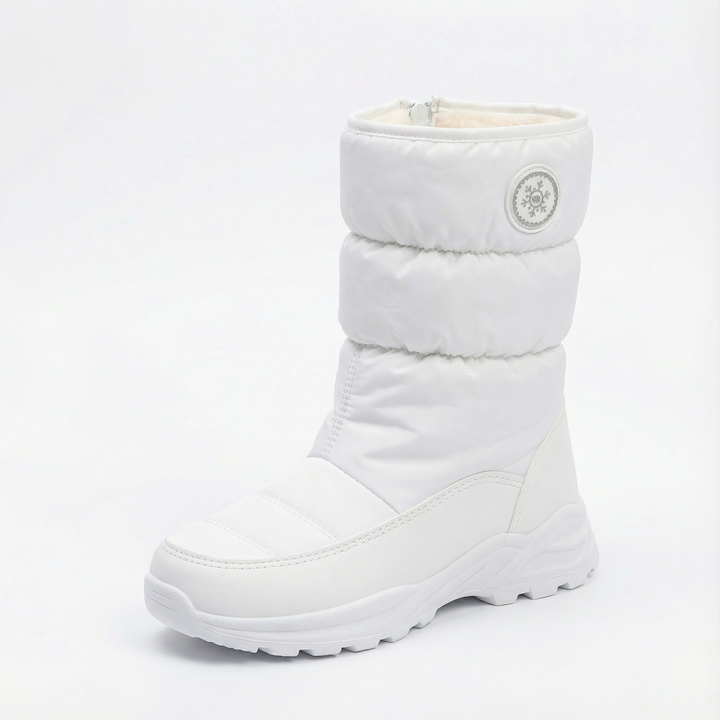 White quilted pull on winter boot with a ridged white sole