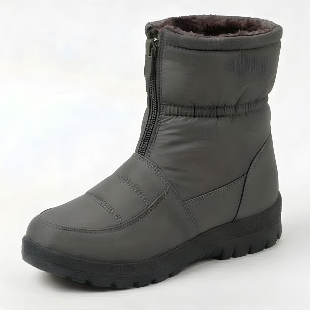 Deep treaded outsole of a black padded winter boot