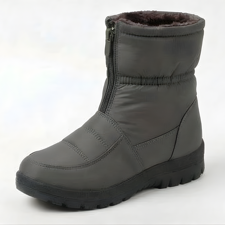 Deep treaded outsole of a black padded winter boot