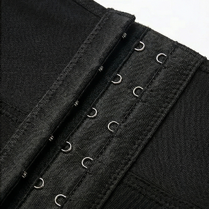 Close-up of the hook and eye column on a black shaper